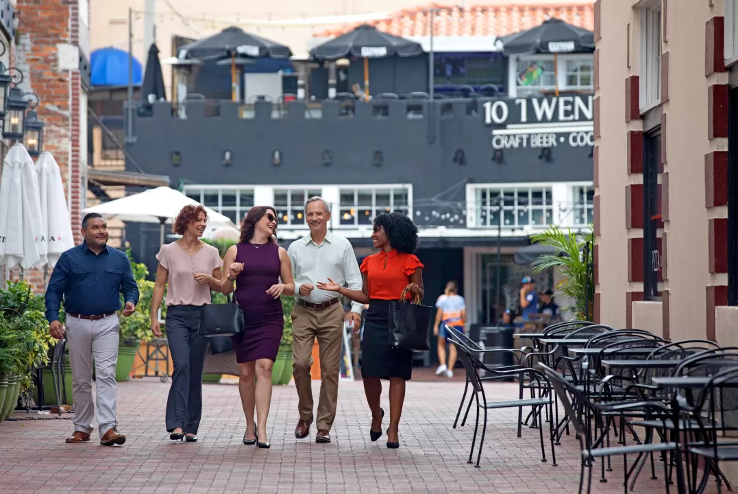 Group walking in the Fort Myers River District