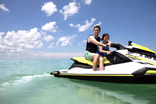 father daughter on jet ski