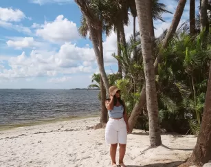 Waves roll onto a sandy beach at a resort spa in Fort Myers.