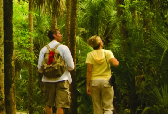 a man and a women hike on a path