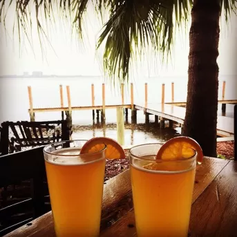 Enjoying a cold beer by the water